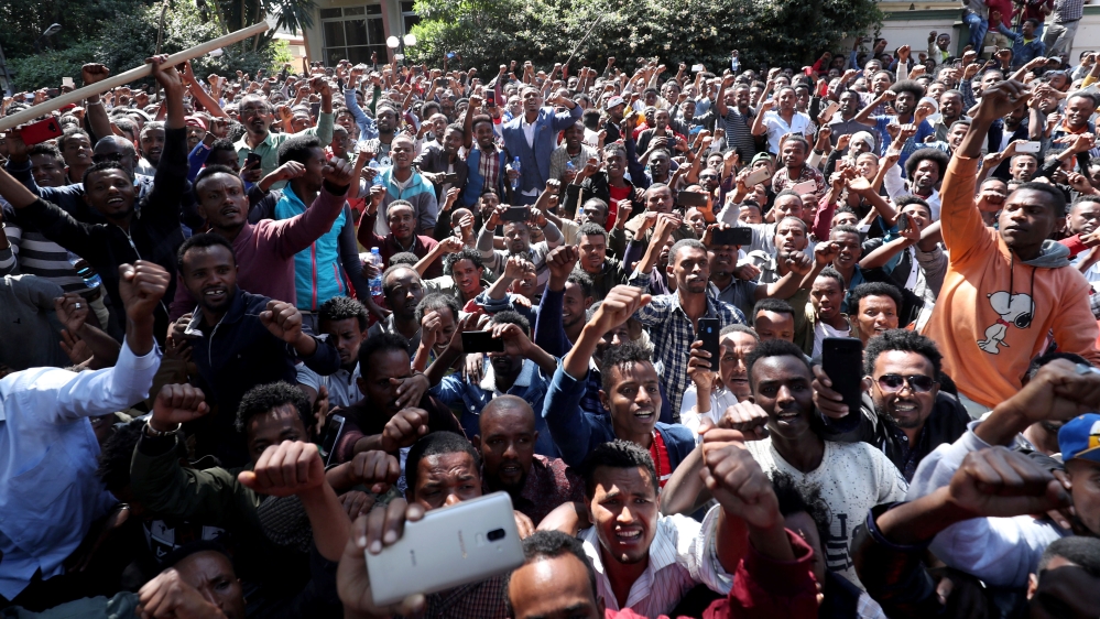 Oromo youth shout slogans outside Jawar Mohammed's house, an Oromo activist and leader of the Oromo protest in Addis Ababa