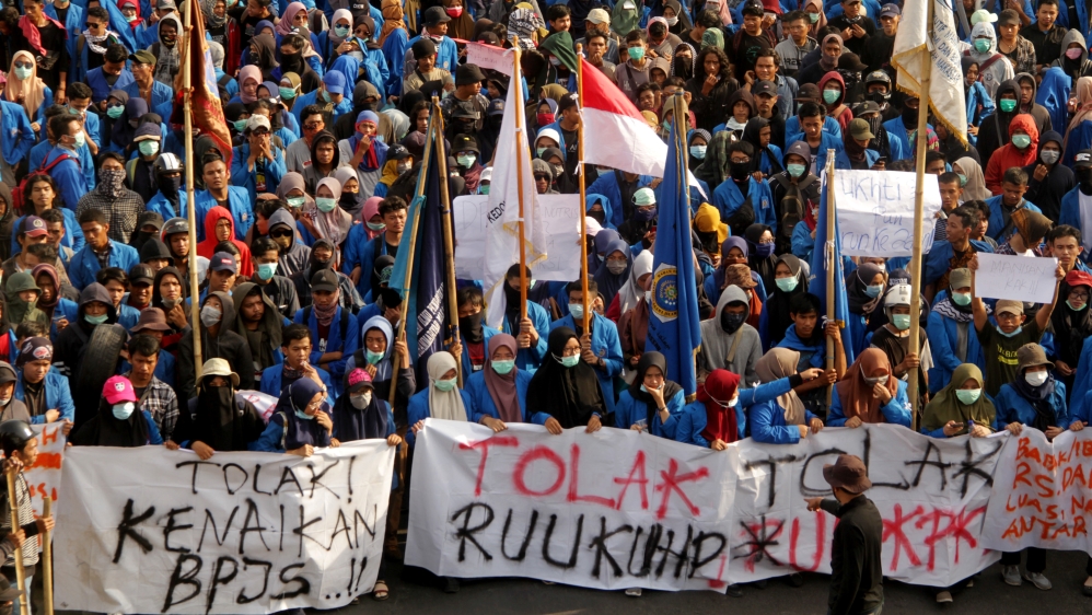 University students march to local parliament building during a protest in Makassar