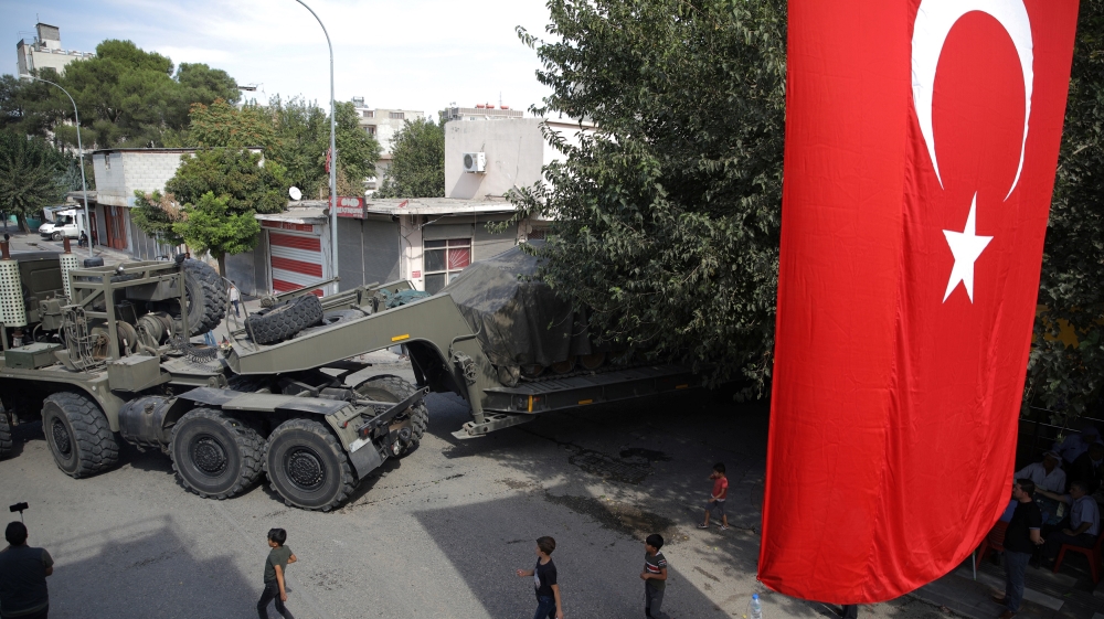 Turkish military equipment is transported on a street in the Turkish border town of Akcakale in Sanliurfa province, Turkey, October 14, 2019