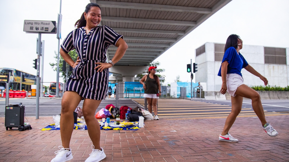 Filipina workers dance during their rest day in Central, Hong Kong on Oct. 14, 2019