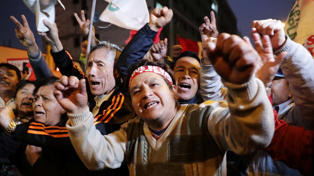 Supporters of Peru's President Martin Vizcarra celebrate outside the Congress building after the president shut down Congress in Lima
