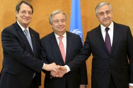 Cypriot President Anastasiades, UN Secretary General Guterres and Turkish Cypriot leader Akinci pose before a trilateral meeting ahead of the Conference on Cyprus at the UN in Geneva