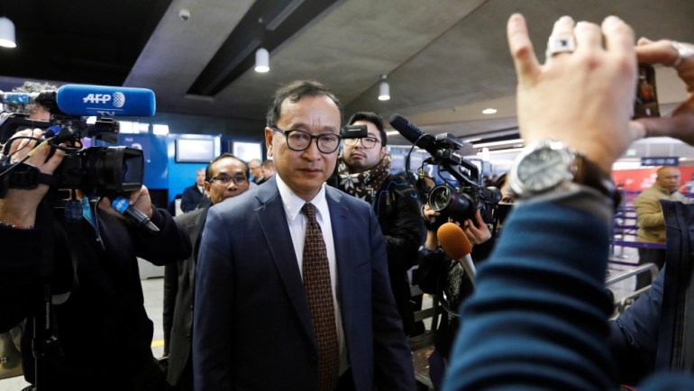 Cambodia''s self-exiled opposition party founder Sam Rainsy, who has vowed to return to his home country, leaves after being prevented from checking-in for a flight from Paris to Bangkok