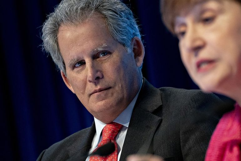 David Lipton, first deputy MD of the (IMF), left, listens as Kristalina Georgieva, MD of the IMF, speaks at a news conference during the annual meetings