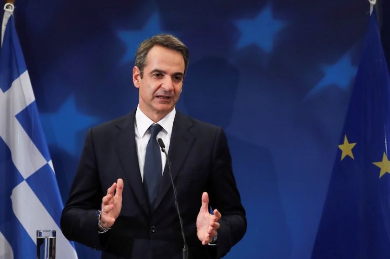 Greek Prime Minister Kyriakos Mitsotakis gestures during a news conference at the end of the European Union leaders summit in Brussels, Belgium December 13, 2019. REUTERS/Yves Herman