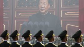 Soldiers of People''s Liberation Army (PLA) are seen before a giant screen as Chinese President Xi Jinping speaks at the military parade