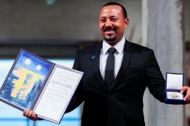 Ethiopian Prime Minister Abiy Ahmed Ali poses with medal and diploma after receiving Nobel Peace Prize during ceremony in Oslo City Hall