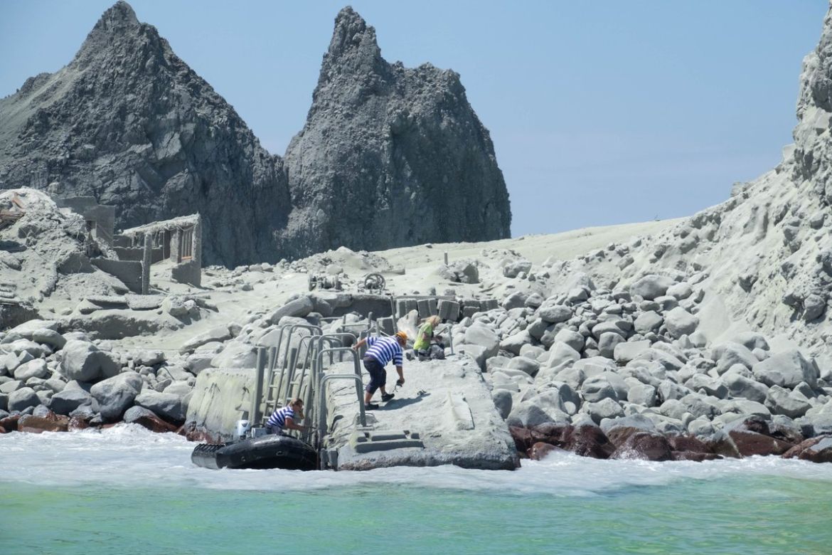 Tour guides evacuate tourists on a boat shortly after the volcano eruption on White Island, New Zealand December 9, 2019 in this picture obtained from social media. @SCH/via REUTERS THIS IMAGE HAS BEE