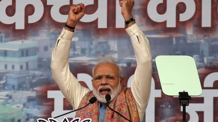 Indian Prime Minister Narendra Modi addresses a rally of his Hindu nationalist Bharatiya Janata Party in New Delhi, India, Sunday, Dec. 22, 2019. Clashes continued Sunday between Indian police and pro