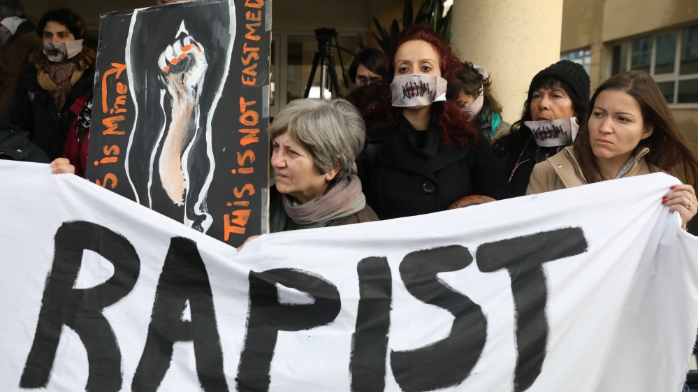 Activists take part in a demonstration, after a British woman was found guilty of faking a rape claim, outside the Famagusta courthouse in Paralimni