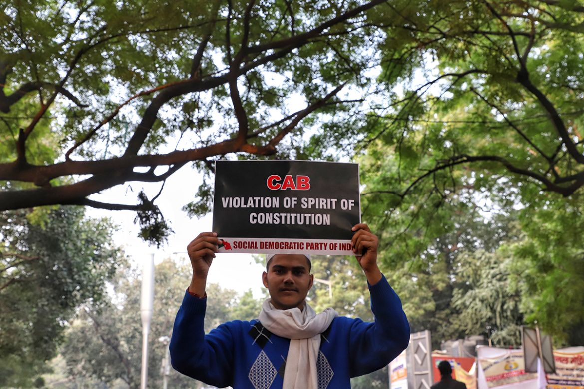 A boy holds a playcard during a protest against the citizenship amendment bill in New Delhi India on 10 December 2019. (Photo by Nasir Kachroo/NurPhoto via Getty Images)