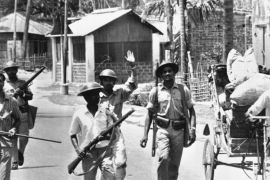 Uniformed East Pakistan rebel forces with armed civilians patrol a street in Jessore, East Pakistan on April 2, 1971 after West Pakistan forces withdrew [AP]
