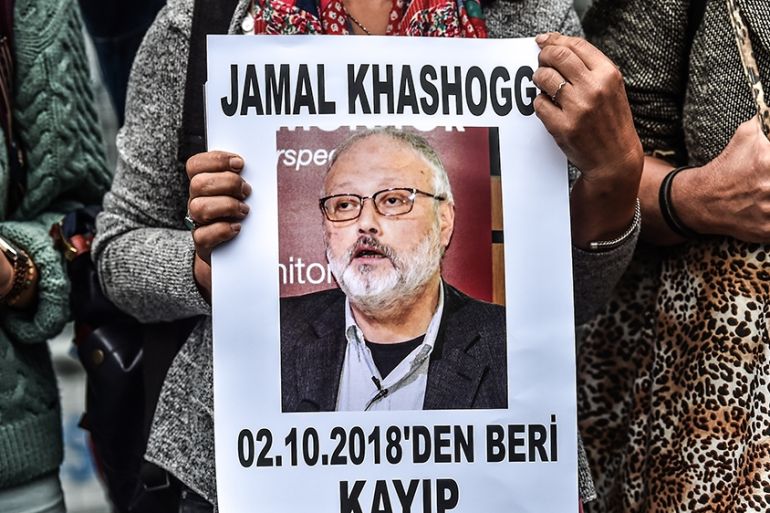 A woman holds a portrait of missing journalist and Riyadh critic Jamal Khashoggi reading "Jamal Khashoggi is missing since October 2" during a demonstration in front of the Saudi Arabian consulate on