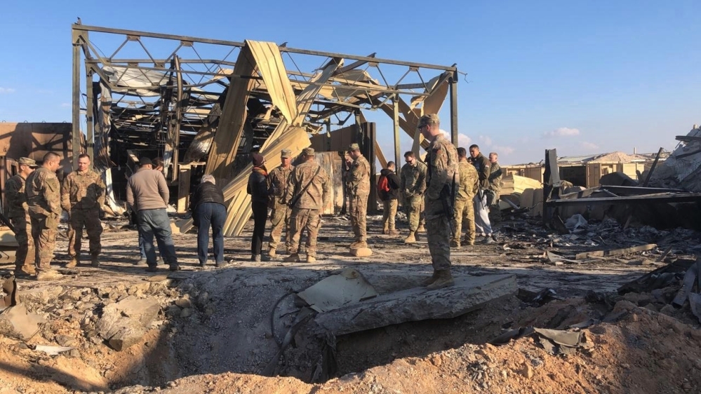 U.S. Soldiers stand at a site of Iranian bombing at Ain al-Asad air base in Anbar, Iraq, Monday, Jan. 13, 2020. Ain al-Asad air base was struck by a barrage of Iranian missiles on Wednesday, in retali