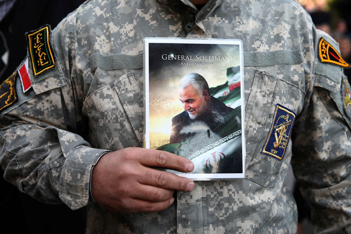 A demonstrator holds the picture of Qassem Soleimani during a protest against the assassination of the Iranian Major-General Qassem Soleimani, head of the elite Quds Force, and Iraqi militia commander