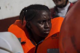 A girl sits on board a boat belonging to Spanish NGO Proactiva Open Arms, after she was rescued in the Mediterranean Sea, 37km (20 nautical miles) from the Libyan coast [File: Angelos Tzortzinis/AFP]