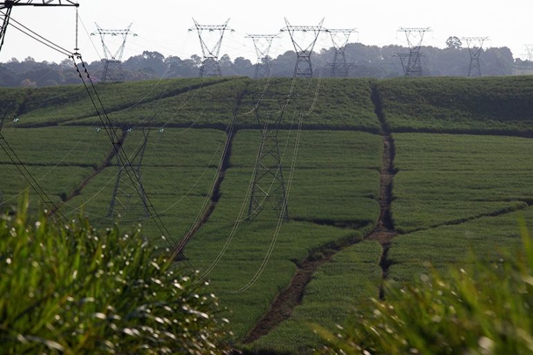 Power lines supplying electricity by state-owned Eskom run through sugar cane fields on a Tongaat Hulett farm in Shongweni, South Africa