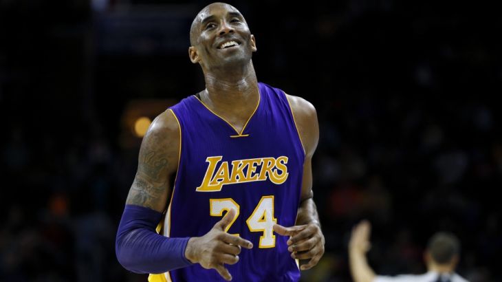 Los Angeles Lakers'' Kobe Bryant smiles as he jogs to the bench during the first half of an NBA basketball game against the Philadelphia 76ers, Tuesday, Dec. 1, 2015, in Philadelphia. (AP Photo/Matt Sl