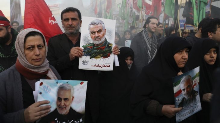 Mourners holding posters of Iranian Gen. Qassem Soleimani attend a funeral ceremony for him and his comrades, who were killed in Iraq in a U.S. drone strike on Friday, at the Enqelab-e-Eslami (Islamic