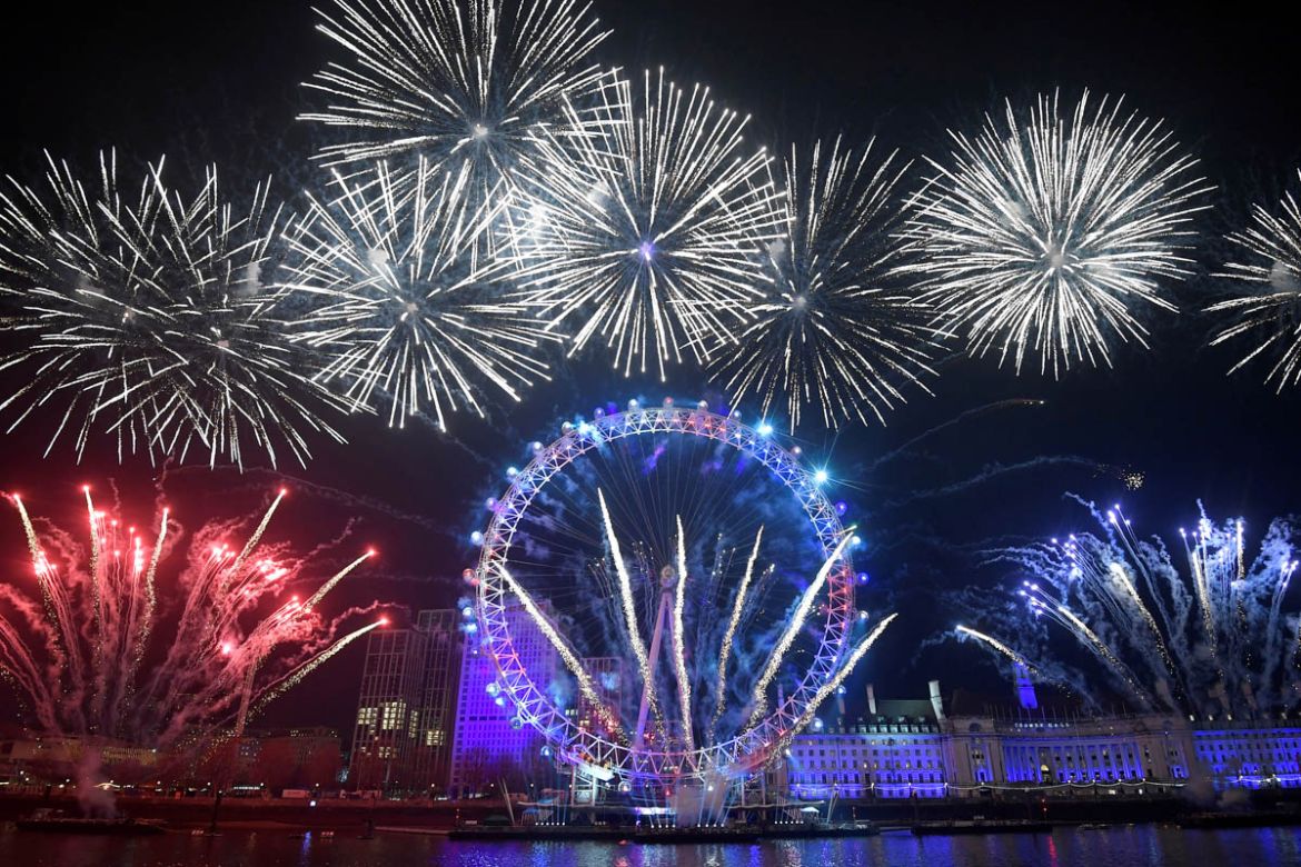 Fireworks explode around the London Eye wheel during New Year celebrations in central London, Britain, January 1, 2020. REUTERS/Toby Melville TPX IMAGES OF THE DAY