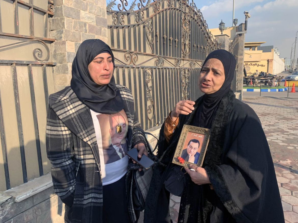 epa08246875 Supporters of former late president Hosni Mubarak hold his photos outside a military hospital where the body is kept, in Cairo, Egypt, 25 February 2020. Former Egyptian President Hosni Mub