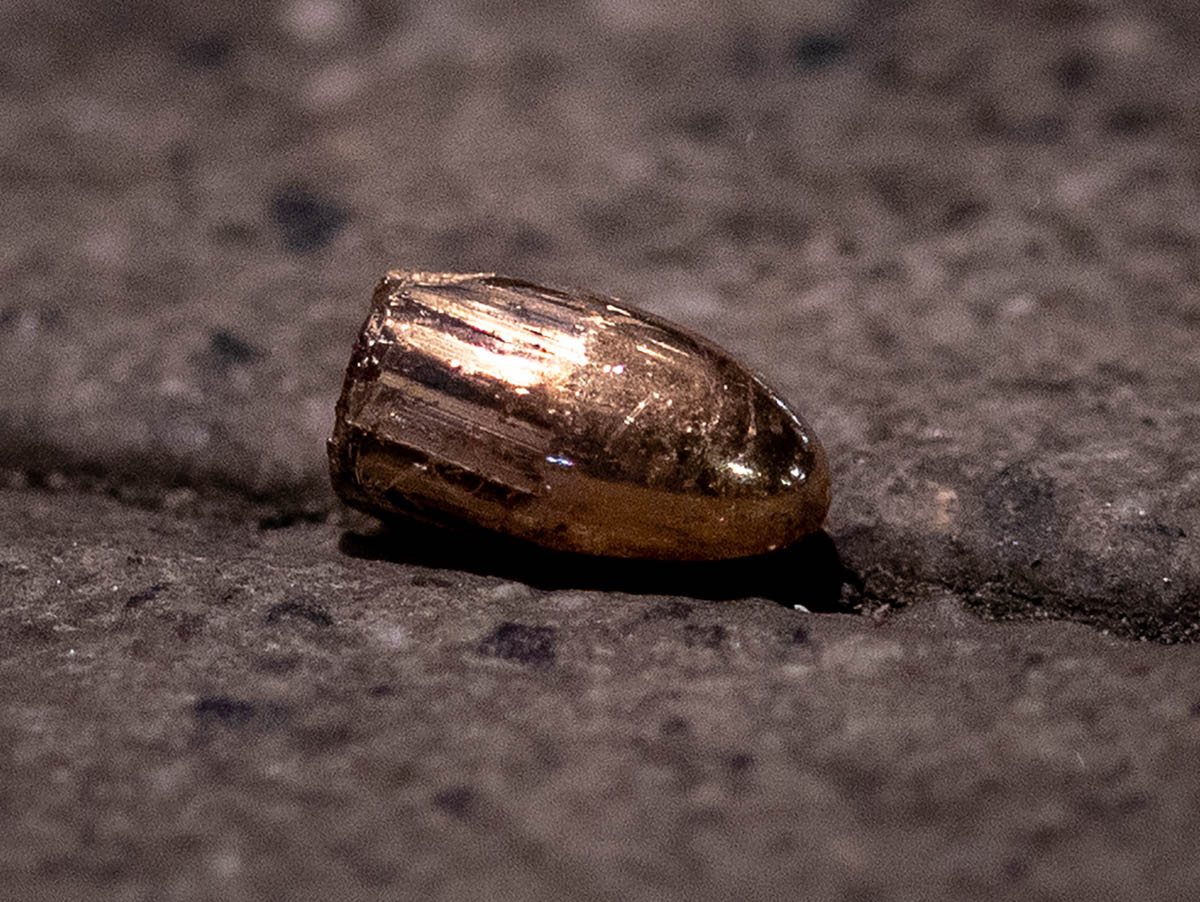 A projectile lies on the sidewalk near a restaurant at the scene of a shooting in central Hanau, Germany Thursday, Feb. 20, 2020. Eight people were killed in shootings in the German city of Hanau on W