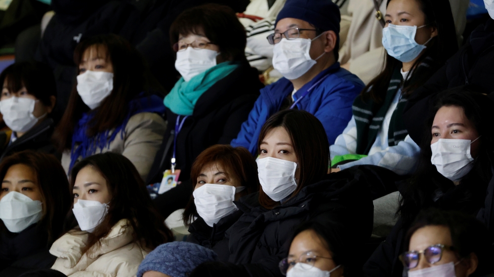 Spectators wearing masks to prevent contacting to a new coronavirus attend Four Continents Figure Skating Championships 2020 in Seoul