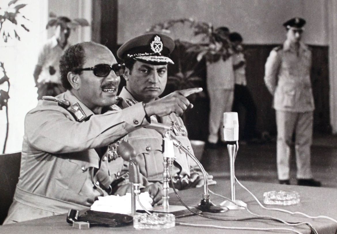 In this undated photo taken in 1979, Egypt''s President Anwar Sadat, left, makes remarks as Vice President Hosni Mubarak, center, looks on in Cairo, Egypt. (AP Photo/Farouk Ibrahim)