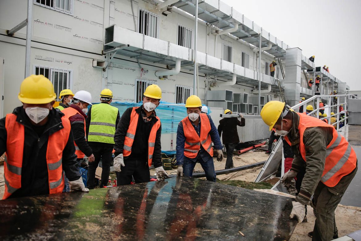 WUHAN, CHINA - FEBRUARY 03: Workers build hospital on February 3, 2020 in Wuhan, China. After only 10 days of construction, Wuhan Huoshenshan Hospital was officially completed and delivered, and on Fe