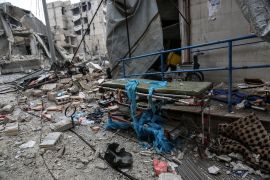 IDLIB, SYRIA - JANUARY 30 : A stretcher is seen outside a hospital near collapsed and damaged buildings after Russian warplanes hit residential areas in Idlib, a de-escalation zone in northwestern Syr