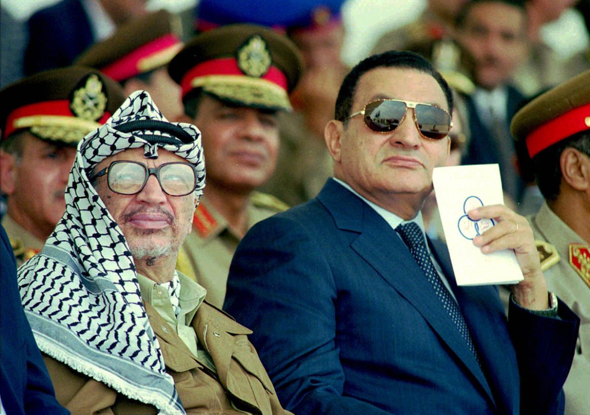 Palestinian Leader Yasser Arafat, left, and Egyptian President Hosni Mubarak watch an Egyptian airforce air show at a base near the town of Bilbeis, 31 miles north of Cairo, Sunday July 14,1996. Arafa