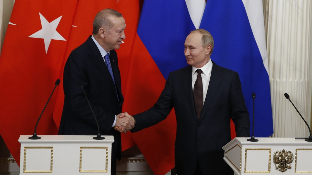 Putin News Conference- - MOSCOW, RUSSIA - MARCH 5: President of Turkey Recep Tayyip Erdogan (L) and President of Russia Vladimir Putin (R) shake hands after their joint news conference following their