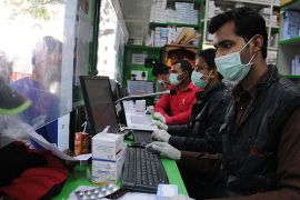 epa08271916 People wear protective masks as a precaution against coronavirus and COVID-19, in New Delhi, India, 05 March 2020. According to media reports, at least 15 Italian tourists and their Indian