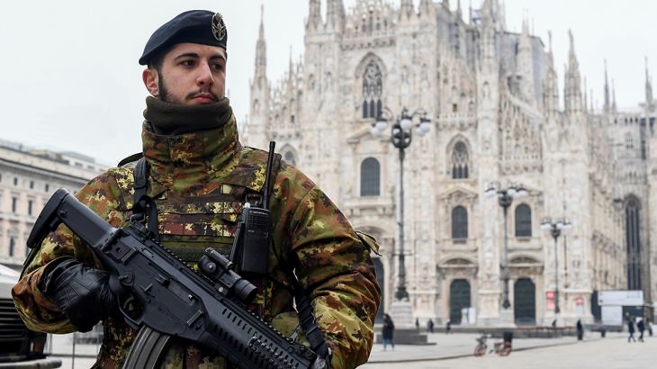 A military officer is seen on Duomo square after a decree orders for the whole of Italy to be on lockdown in an unprecedented clampdown aimed at beating the coronavirus, in Milan, Italy, March 10, 202