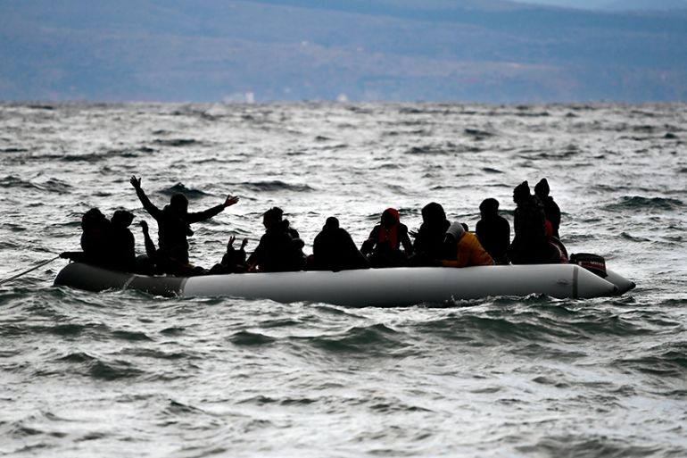 Migrants onboard a dinghy arrive at the village of Skala Sikaminias, on the Greek island of Lesbos, after crossing the Aegean sea from Turkey, Saturday, Feb. 29, 2020. Hundreds of refugees and migrant