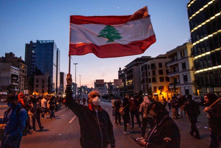 epa08390321 Anti-government protesters attend a protest against the collapsing Lebanese pound currency and the price hikes of goods in Beirut, Lebanon 28 April 2020. According to media reports, the Le