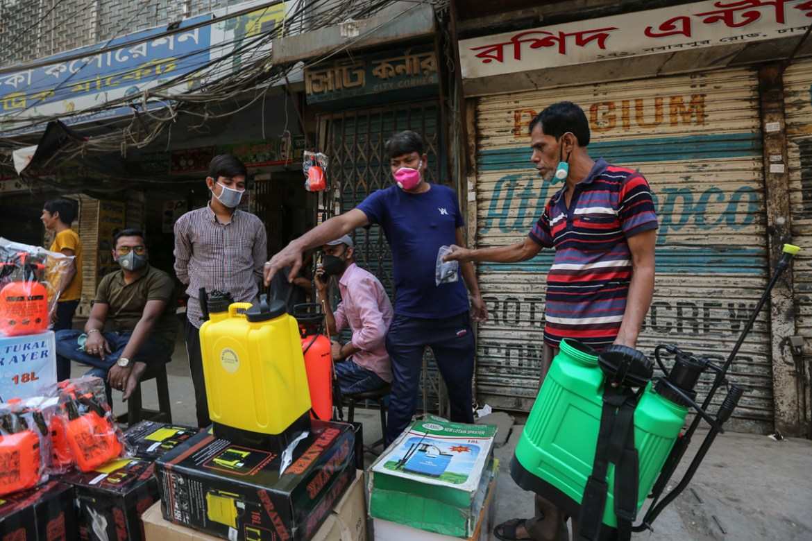 Sales of spray machine in Dhaka''s Nawabpur Road have spiked as people are coming to buy the machines for use at homes or on streets. Mahmud Hossain Opu/Al Jazeera