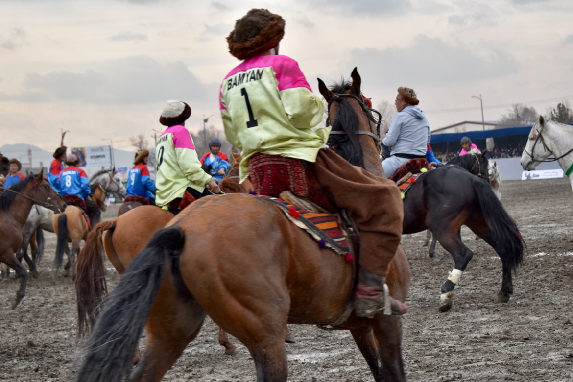 A game of Buzkashi between players from Baghlan and Bamyan province, on the second day of the Buzkashi league, at Chaman-e-Hazouri stadium in Kabul, on Thursday. Photo by Hikmat Noori.