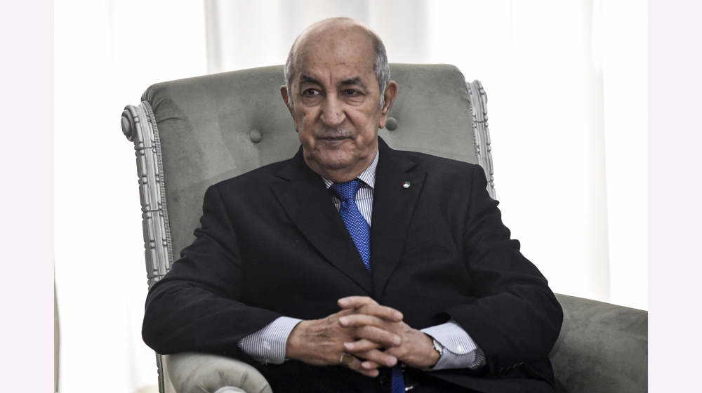 Algerian President Abdelmadjid Tebboune meets with the visiting French Foreign Minister (unseen) in the capital Algiers on January 21, 2020. Le Drian arrived to Algiers for a brief visit to discuss bi