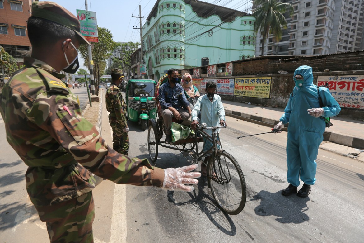 Bangladesh army sprays disinfectant amid concerns about the spread of coronavirus disease (COVID-19) in Dhaka, Bangladesh. Mahmud Hossain Opu/ Al Jazeera