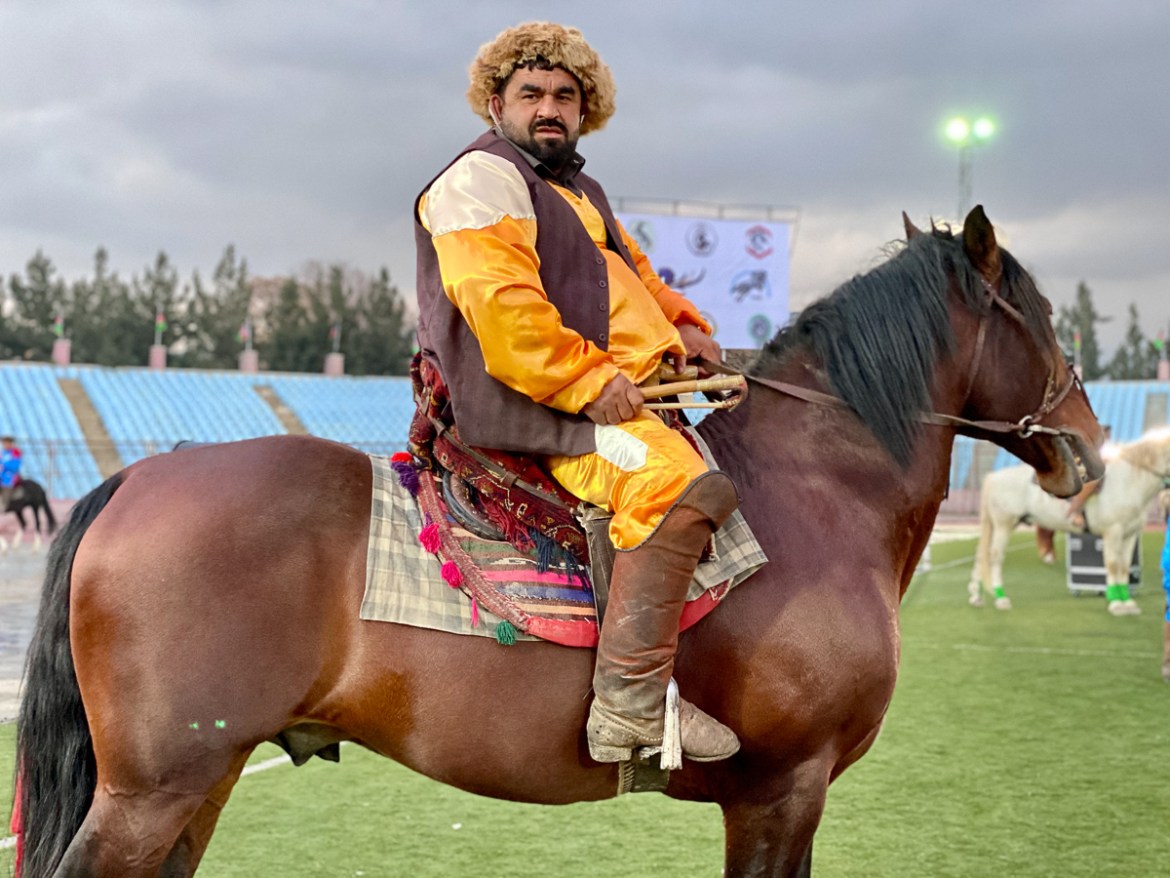 Haji Badal Baai, a Buzkashi player from Kunduz province, on his horse ahead of the inauguration of the first-ever Buzkashi League on March 7. Photo by Hikmat Noori.