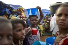 A Fulani girl woman holds a bowl of food on her head in an Internally Displaced People''s (IDP) camp in Faladie, where nearly 800 IDPs have found refuge after fleeing inter-communal violence in central