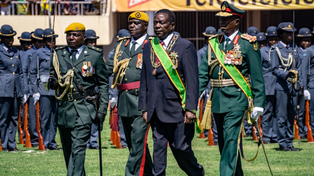 President Emmerson Mnangagwa inspects a police parade accompanied by the top members of the military during his inauguration after a disputed election victory in 2018.