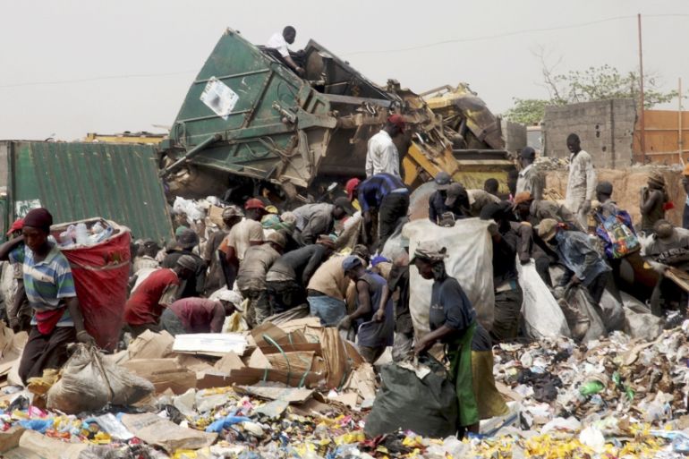 Scavengers work picking up trash for recycling at the Olusosun dump site in Nigeria''s commercial capital Lagos