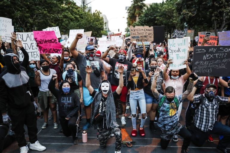 Protesters briefly block a street as they rally in Las Vegas, over the death of George Floyd, a black man who was in police custody in Minneapolis. Floyd died after being restrained by Minneapolis po