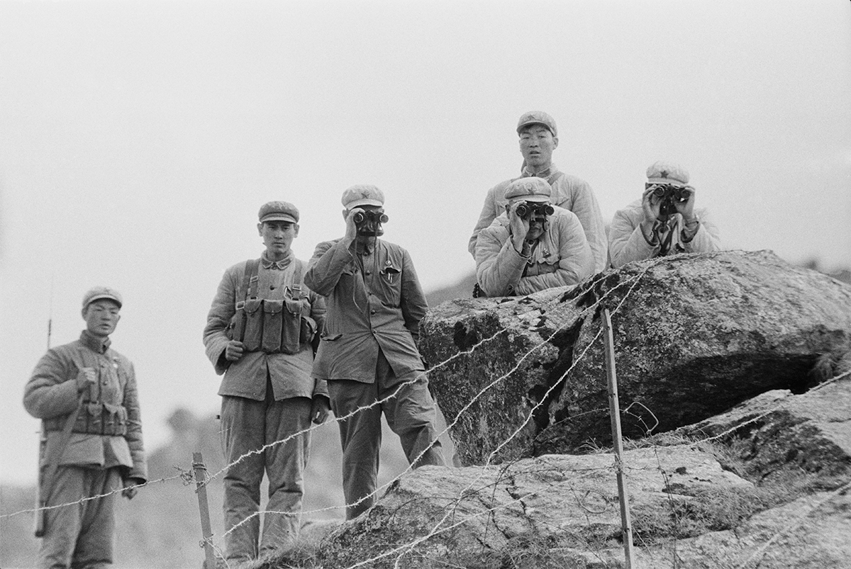 Chinese soldiers guard the border on the Nathu La mountain pass connecting India and China's Tibet Autonomous Region during the Chola incident (or Sino-Indian skirmish), Himalayas, 3rd October 1967. (