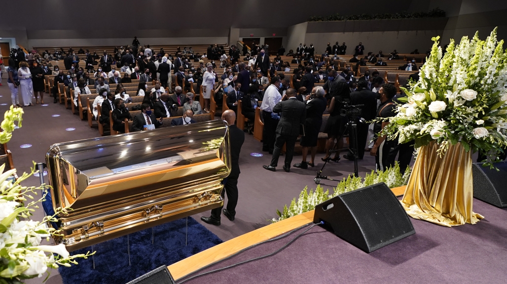 Mourners pause by the casket during a funeral service for George Floyd at the Fountain of Praise church, Houston, Texas, USA, 09 June 2020. A bystander's video posted online on 25 May, appeared to sho