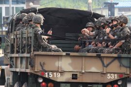 South Korean army soldiers ride on the back of a truck in Paju, near the border with North Korea, South Korea, Wednesday, June 17, 2020. North Korea said Wednesday it will redeploy troops to now-shutt
