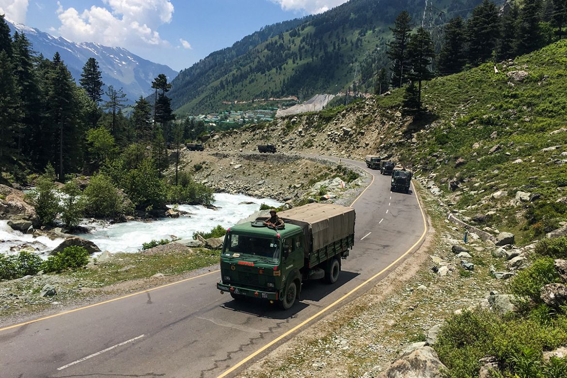 epa08490228 Indian army trucks move along a highway leading to Ladakh, at Gagangeer some 81 kilometers from Srinagar, the summer capital of Indian Kashmir, 17 June 2020. According to news reports, twe