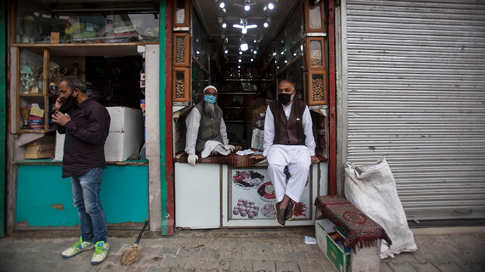 Kashmiri shopkeepers wearing face-masks wait for customer at a market in Srinagar, India, Saturday, June.13, 2020. Over two-and-a-half months after the coronavirus lockdown or Covid-19, was implemente